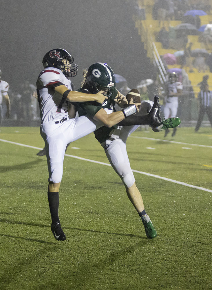 Cave Spring's (15) Ben Robinson breaks up a pass in the end zone against Glenvar's (21) Colby Street.